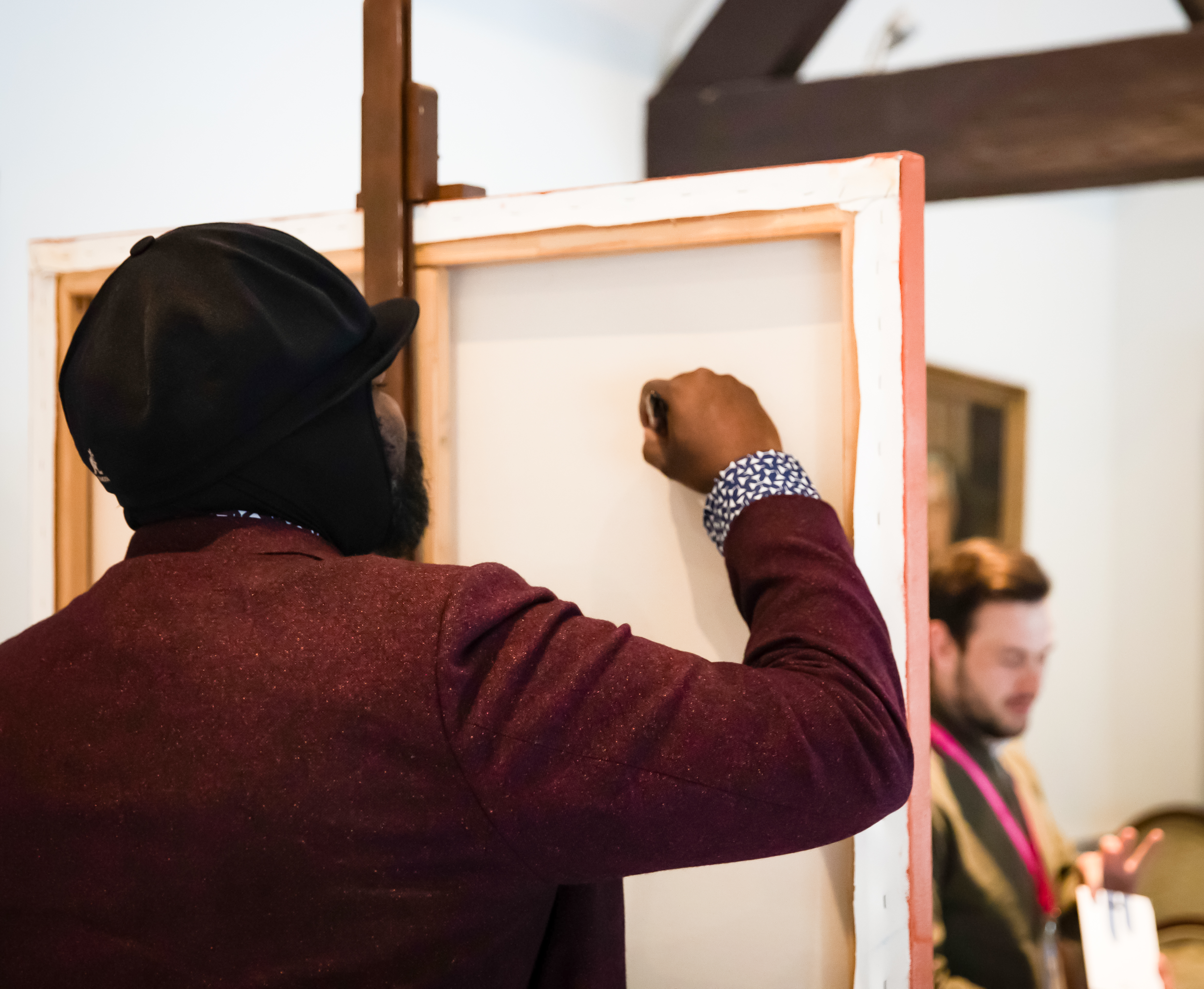 Gregory Porter signing the reverse of the painting. 