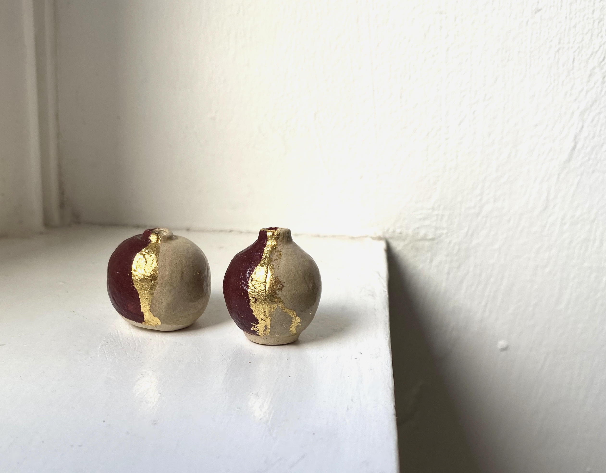 Gilded autumn duo-tone miniature vases, with 24 carat gold leaf detail.